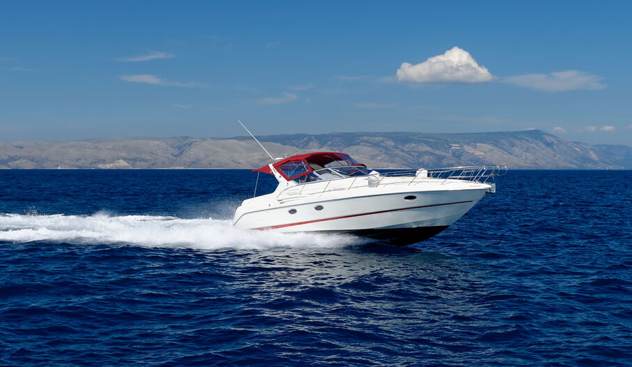 Speed boat racing on a lake