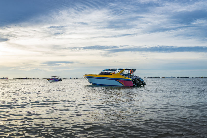 Boat and sunset in a beach of Thailand