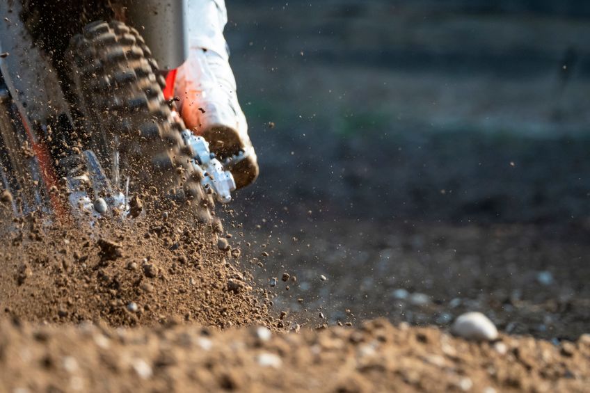 dirt bike racing on off road trail